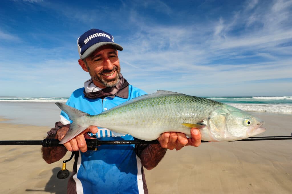 Fishing rod and reel setup for surf fishing, including a lightweight rod and spinning reel.