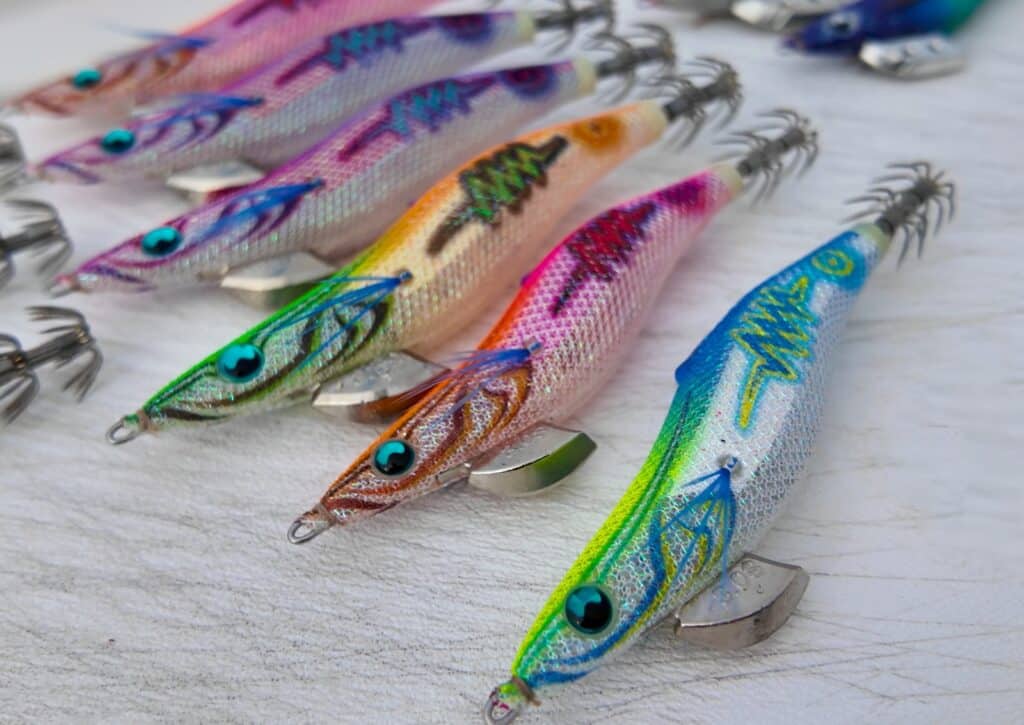 Yamashita EGI-OH Search Shallow squid jigs in daylight showing the Neon Bright body colours and foil flash