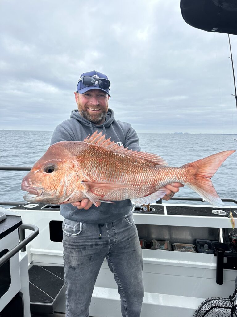 Quality snapper held up on a boat in Westernport